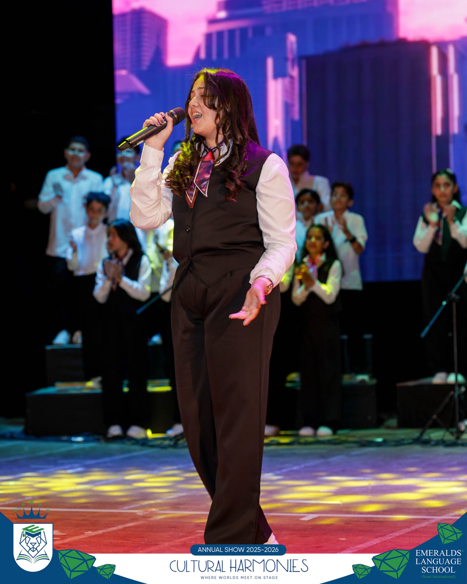 Emeralds student singing on stage